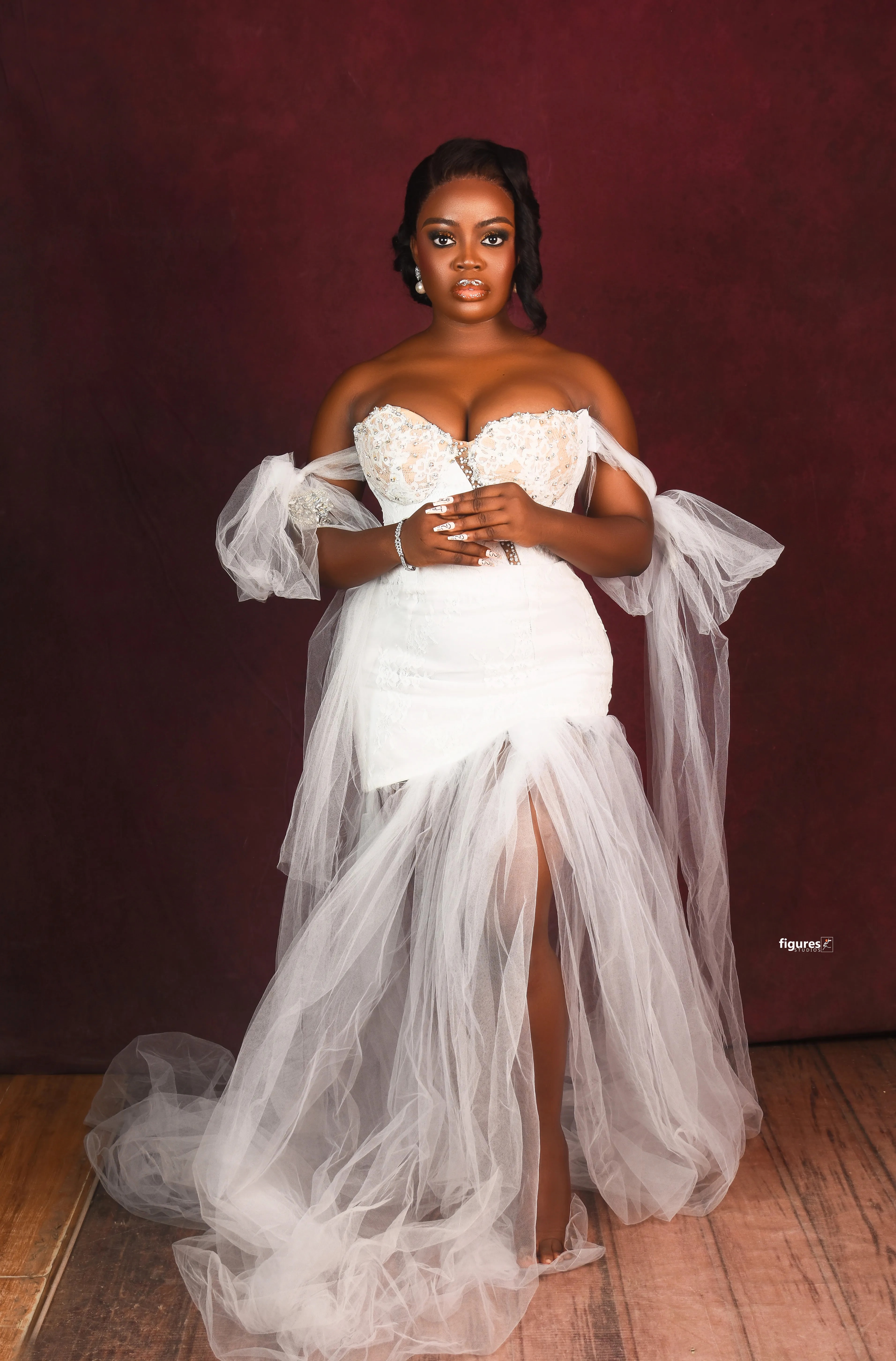 Bridal makeup look with a dramatic white gown